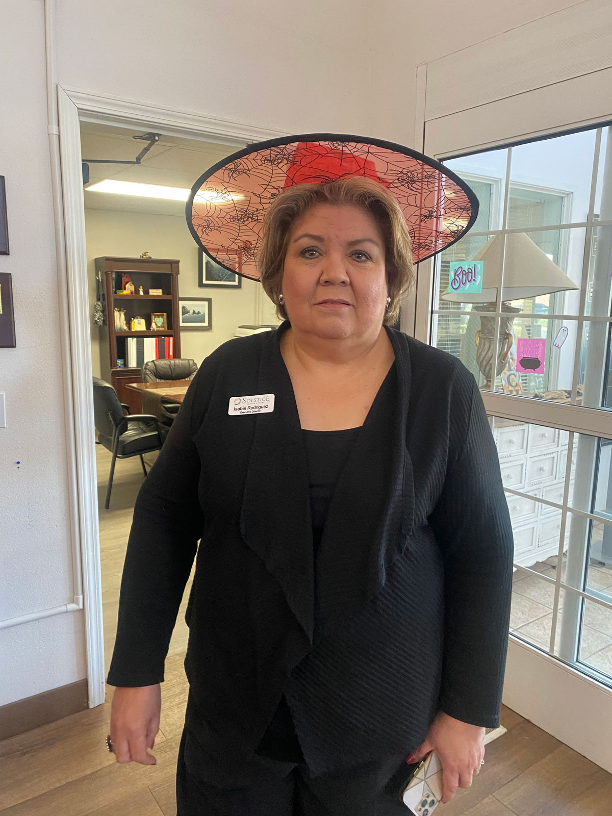 Executive Director Isabel Rodriguez in Halloween hat Las Cruces